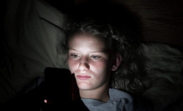 child uses  cellphone at night